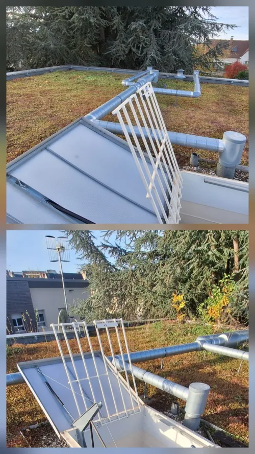 Exutoire de désenfumage et gaines dégagés sur une toiture-terrasse végétalisée